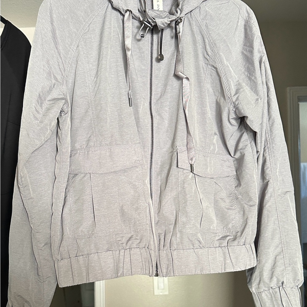Lorna Jane Light Gray windbreaker, activewear, leisurewear jacket with hood.